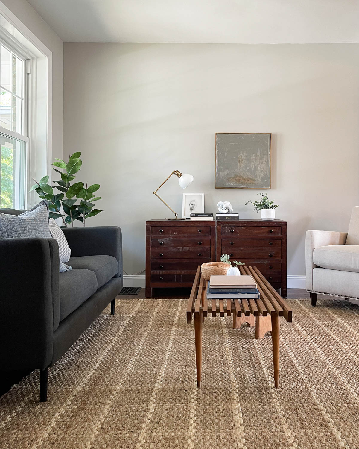 A couch and midcentury coffee table staged in a living area.